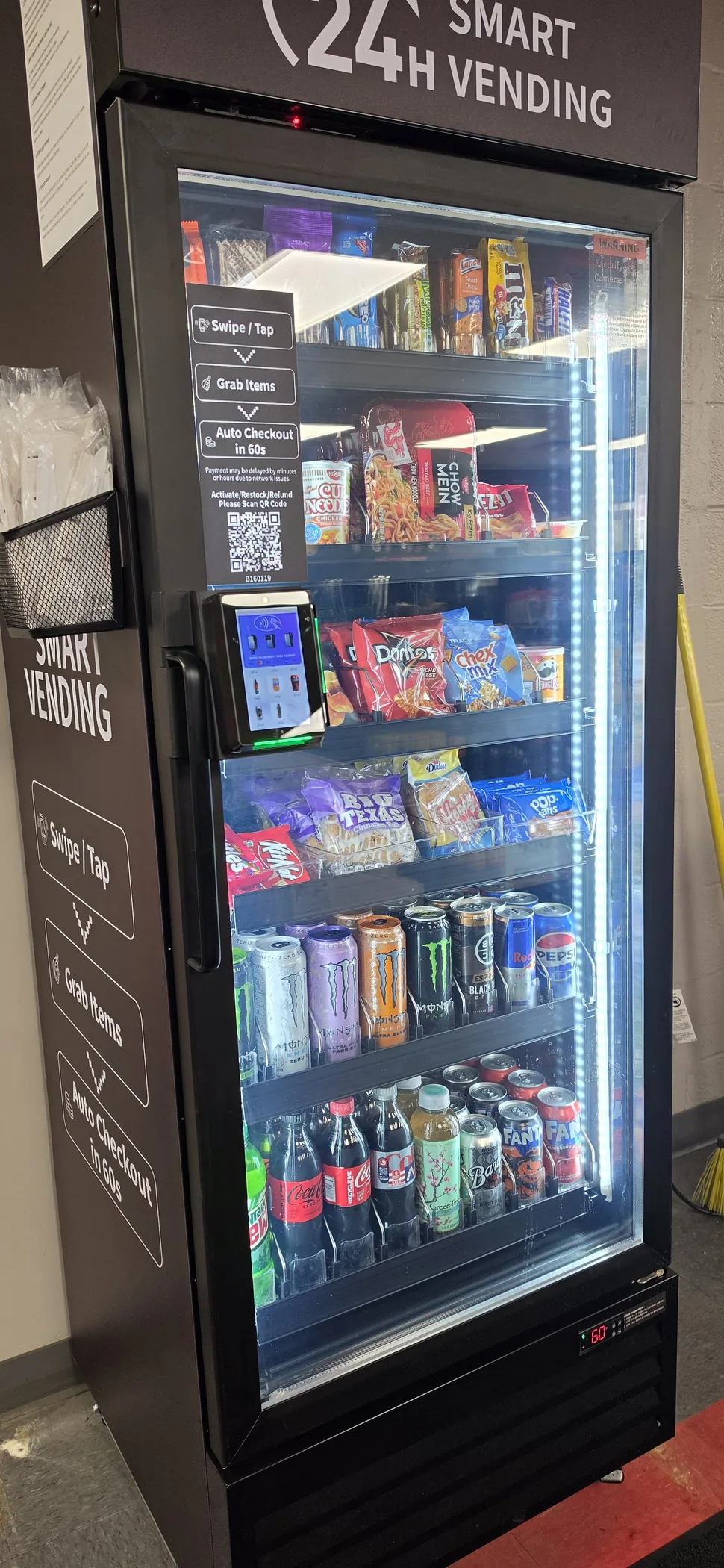 Angled view of a stocked smart cooler in a customer location
